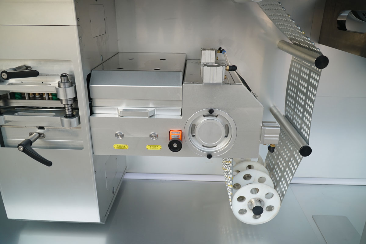 BMR270 Blister Machine - Servo-Driven Indexing System Close-up of the advanced servo-driven index system on the BMR270 rotary blister machine, ensuring precise web advancement, synchronization, and optimal material handling for continuous high-speed pharmaceutical packaging.