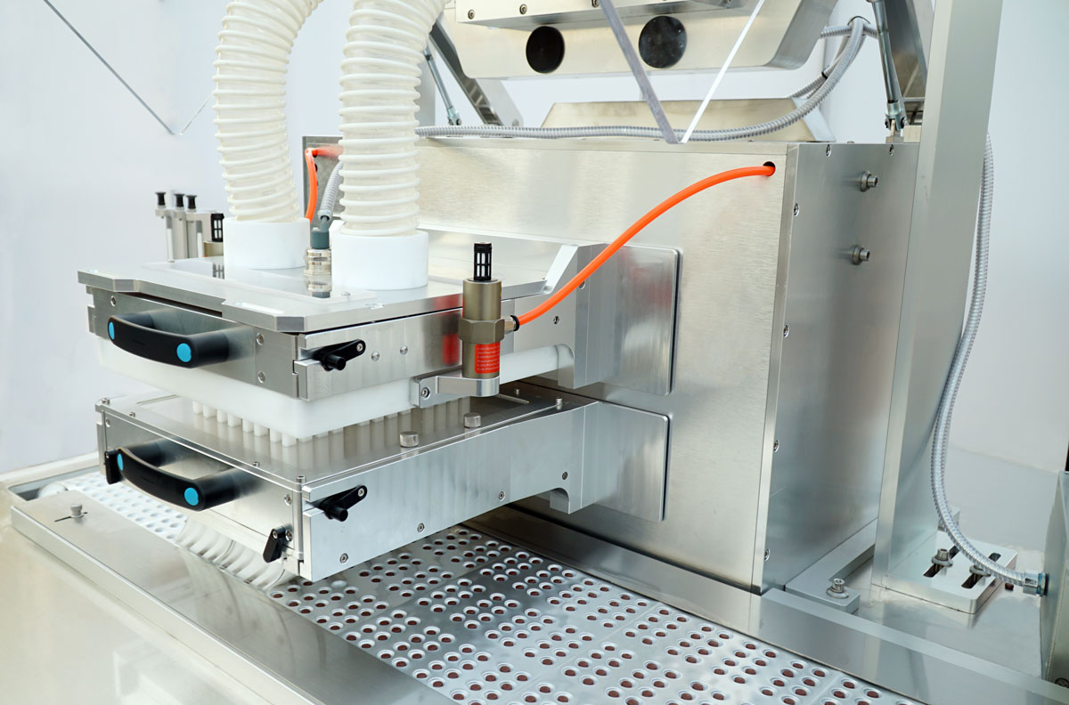 BMR270 Blister Machine - Dedicated Cold-Formed Alu-Alu Feeder Close-up of the dedicated blister feeding system for cold-formed Alu-Alu packaging on the BMR270 rotary machine, showcasing specialized mechanisms engineered to ensure precise, high-speed product placement into opaque cavities.