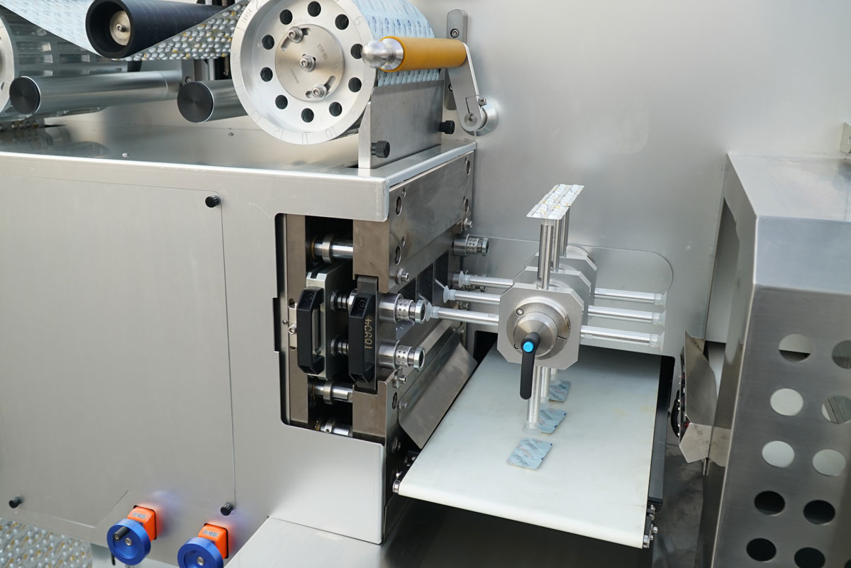 BMR270 Blister Machine - Precision Punching Station Close-up of the precision punching and die-cutting station on the BMR270 blister packaging machine, cleanly severing individual blister cards from the web to optimize material consumption for pharmaceutical production.