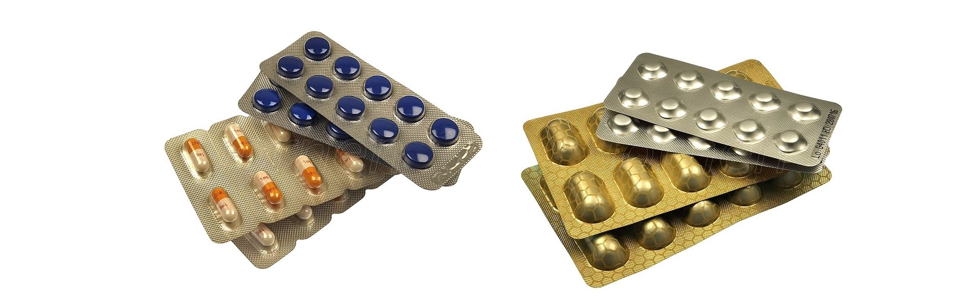 Pharmaceutical blister packs showing both transparent PVC thermoforming and opaque cold-formed Alu-Alu formats